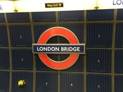 sign of london station on the wall