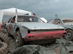 broken car in a landfill