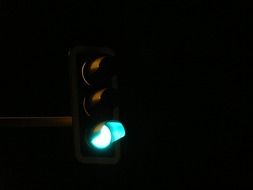 green light at the traffic lights in the dark