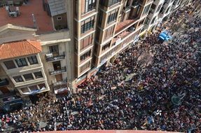 crowd of people on street at sunny day, top view, spain, valencia