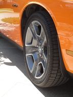 tires of a orange car close-up