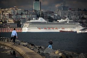 cruise ship in the port of a big city