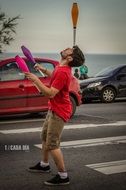 juggler, street artist on road