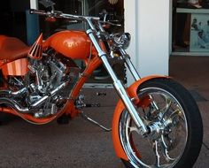 Orange high-speed motorcycle on the street