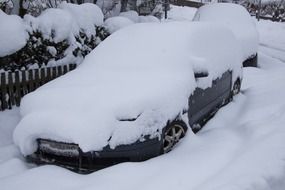the car is covered with snow