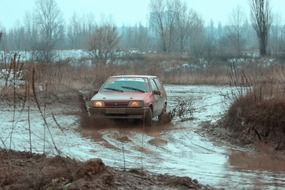 racing car on the track in the mud