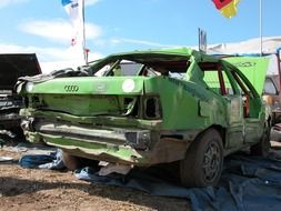 green car in a landfill