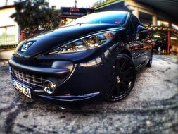 black peugeot on the street
