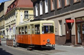 Colorful tram on the old street in Guben