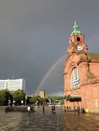 rainbow behind the train station