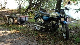 vintage moped by the lake