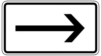 road sign with a black arrow