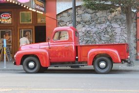 old red pickup truck on a road