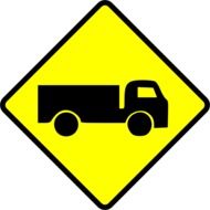 painted warning sign depicting a truck