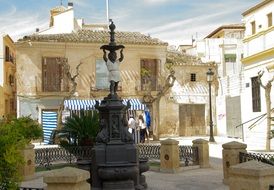 picturesque old town square with child boy sculpture, spain, andalusia, lorca