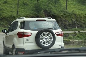 white jeep on the road