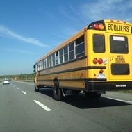 school bus rides on the highway