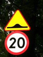 speed limit sign and rough road sign