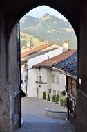 landscape view of old town through arched gateway