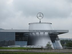 cloudy sky above mercedes benz factory