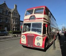 vintage titan ribble double-decker bus in old city