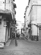 grey photo of street in France