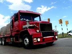 red truck near traffic lights