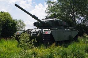 centurian tank stands on green grass