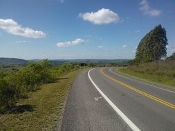 road with a sharp turn in a picturesque landscape