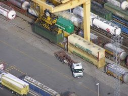 truck near containers with goods