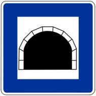 road sign in front of the tunnel