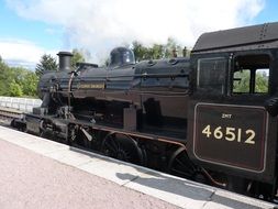 vintage steam locomotive on the platform