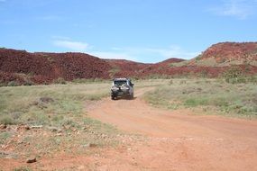 Picture of the car on a road in a desert