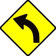 curved road, traffic sign with black arrow