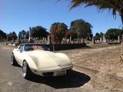 corvette stingray car near the cemetery