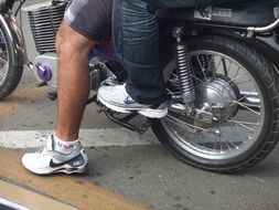 two people traveling on a motorcycle