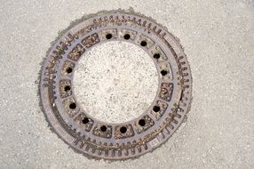 manhole cover on an asphalt road