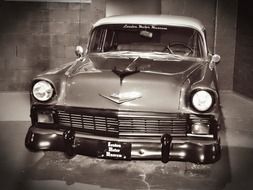 black and white photo of a museum car