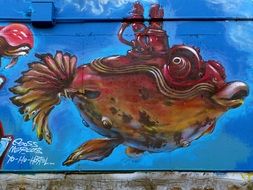 Colorful fish graffiti on the wall