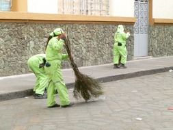 green street sweepers clean the street