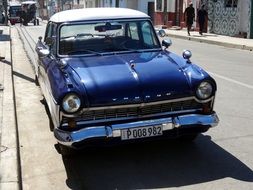 blue retro car on the road