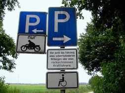 road signs about parking disabled and motorcyclists