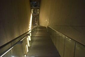 alley with glass handrails in night illumination