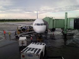 passenger airplane in airport on rainy weather