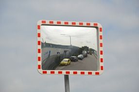 Cars in the street mirror