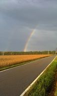 rainbow over a rural road
