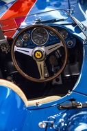 steering wheel on blue ferrari