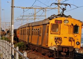 yellow train on a railway