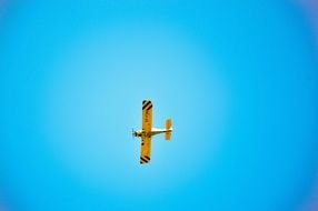 Yellow airplane in the sky