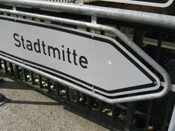 metal shield with the name "stadtmitte"